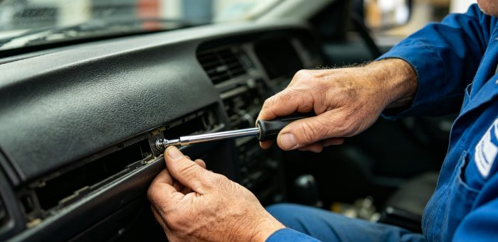 Mechanic repairing stuck Shacman door handle (genuine Mettlead part)