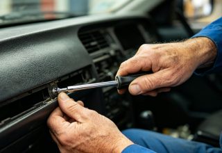 Mechanic repairing stuck Shacman door handle (genuine Mettlead part)